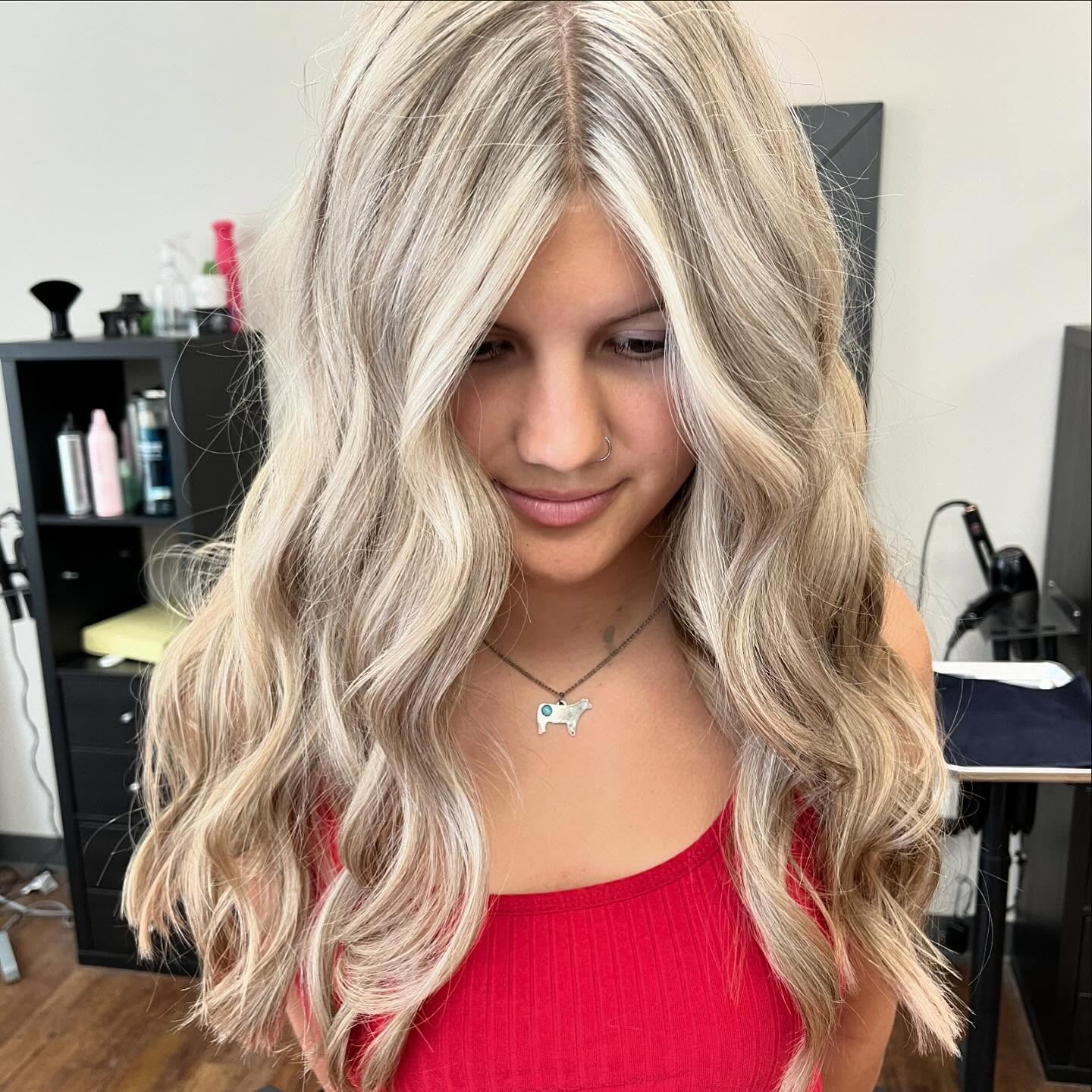 Bright blonde layered waves framing the face