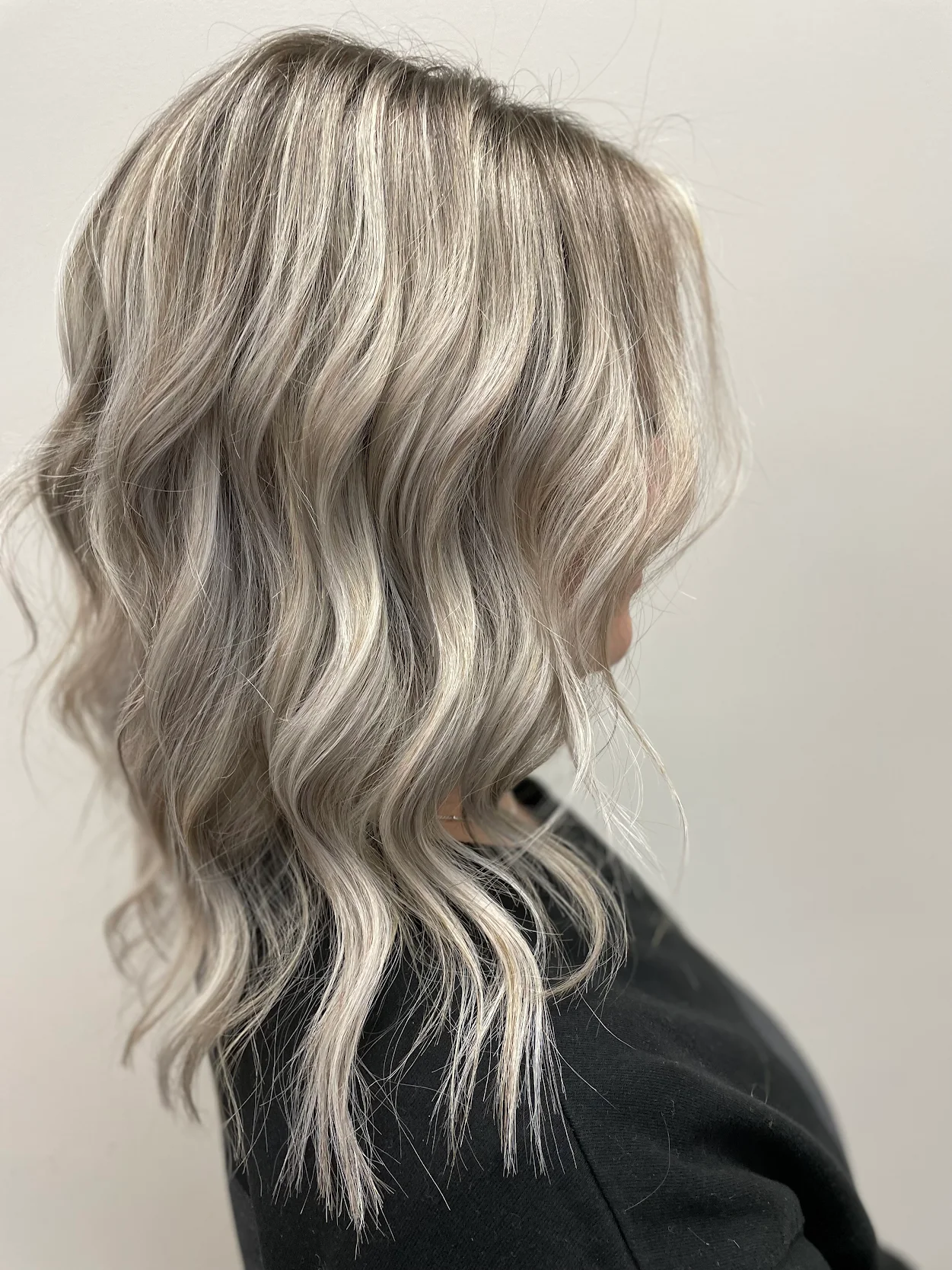 Cool blonde balayage with loose editorial waves
